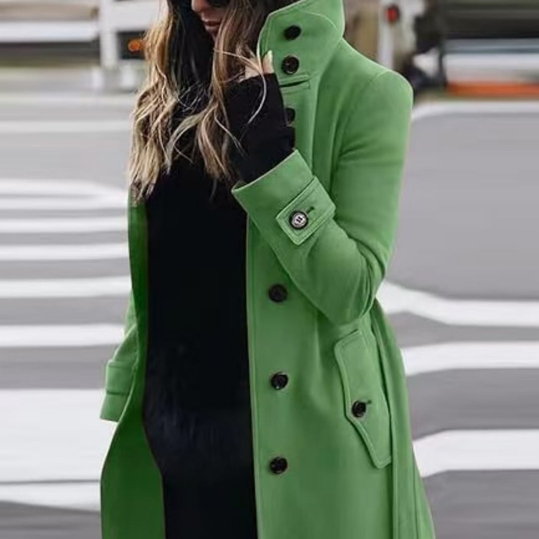 Person wearing a green coat on a street